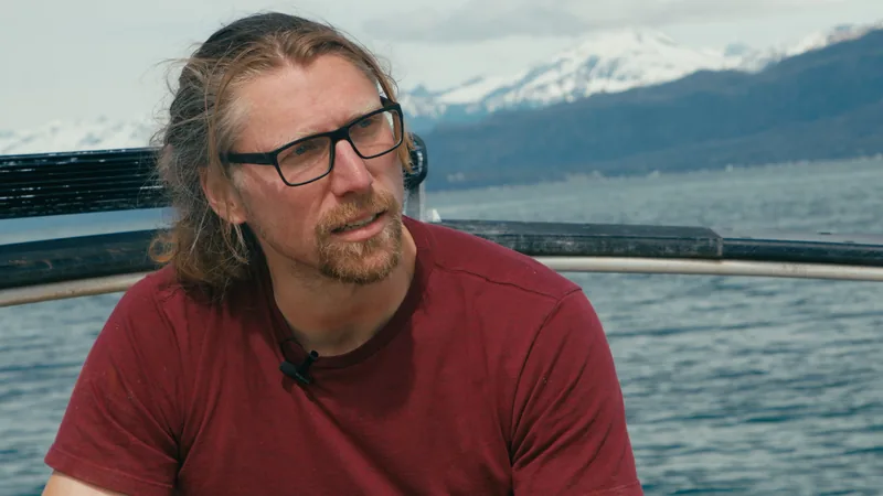 A man sitting on a boat.