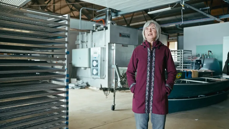 A woman inside a factory.