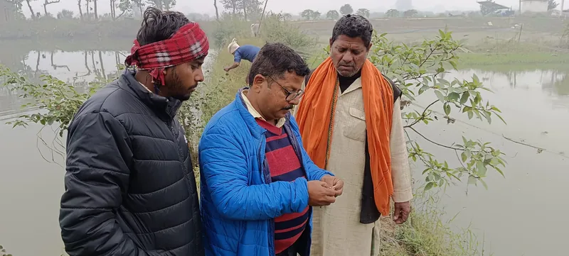 Three men talking.