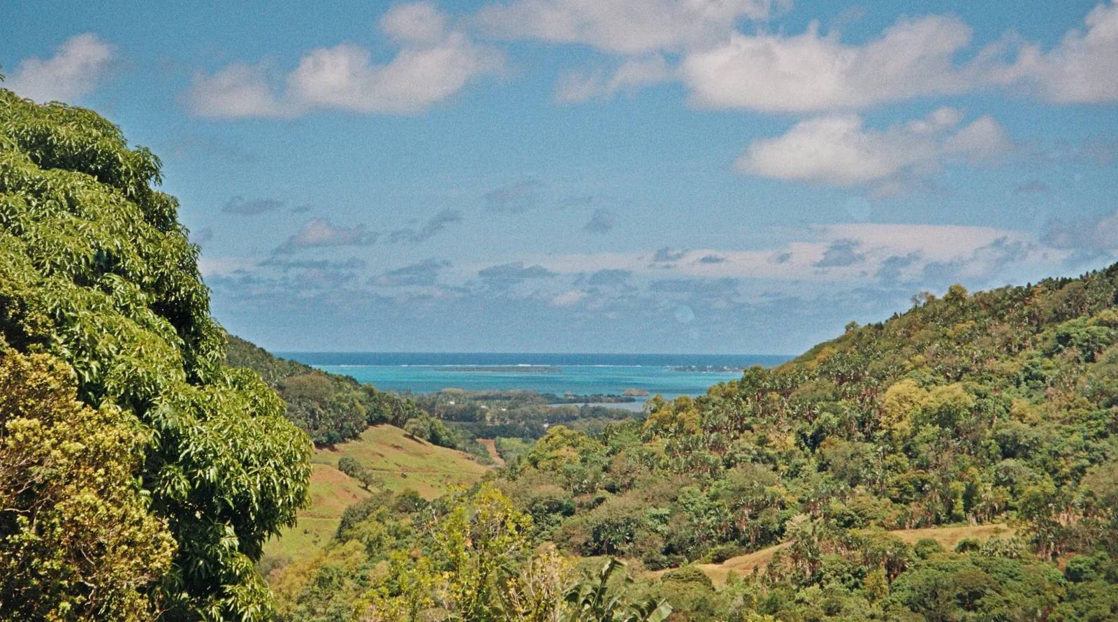 A view of a turquoise lagoon from the mountains in Mauritius.