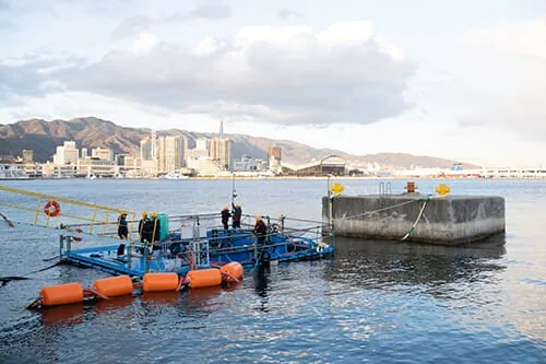 A small fish farm in a busy port.